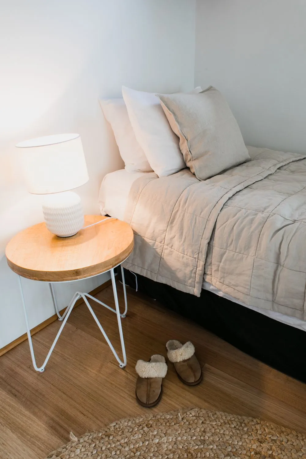 A bed made with a quilted blanket on top, standing in for a heated blanket